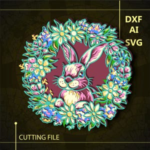 May include: A digital cutting file design featuring a pink and yellow bunny rabbit surrounded by a wreath of colourful flowers. The design is perfect for creating a variety of crafts, such as cards, scrapbook pages, and home decor.