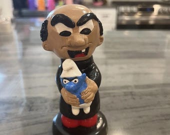 Gargamel Holding A Smurf Altered From A  Precious Moment Figurine