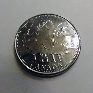 2002 Canadian 25 Cents (Canada Day 2002p variety). Grade: Uncirculated. Taken from a Mint Roll (22I04U10a)