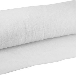 May include: A white, rolled up piece of landscape fabric. This fabric is used to prevent weeds from growing in gardens.