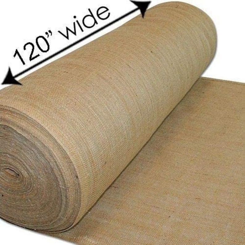 May include: A roll of natural brown burlap fabric, 120 inches wide. The fabric is rolled up and the end is unfurled, showing the texture of the material.