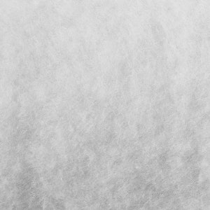 May include: A close-up of a white, textured surface. The surface has a subtle, grainy appearance, resembling a fine-grained fabric.