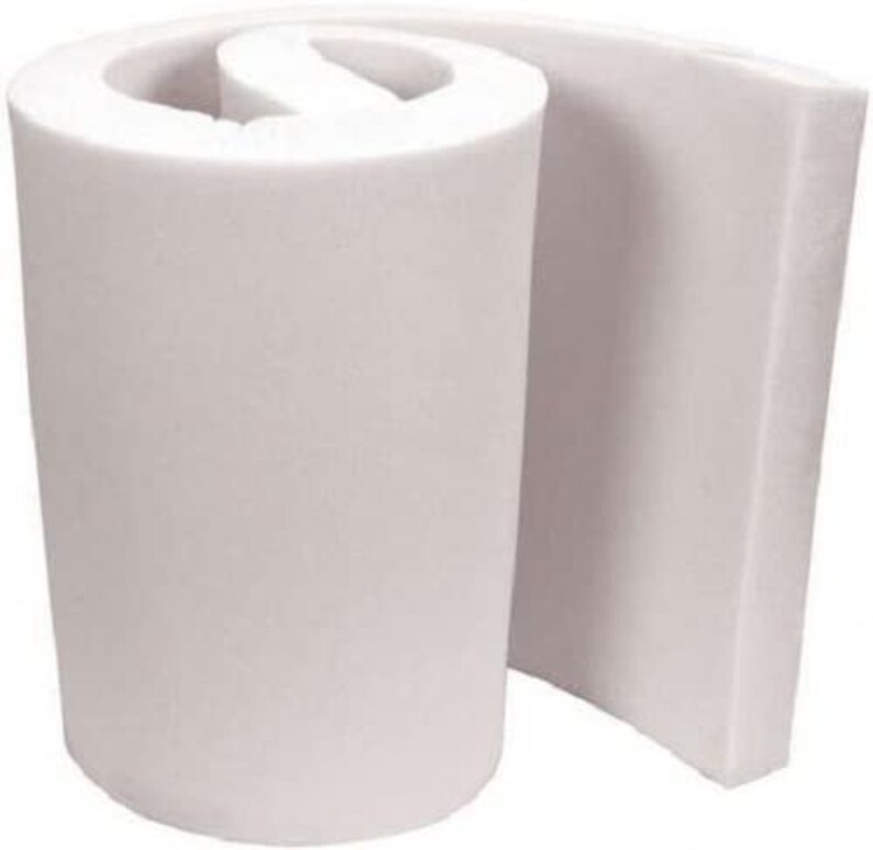 May include: A white foam roll, rolled up and partially unrolled, showing the thickness of the foam. The foam is a light white color and has a smooth texture.
