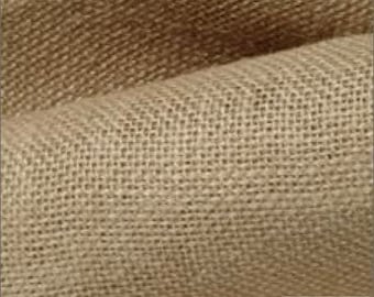 May include: Close-up of natural brown burlap fabric with a woven texture. The fabric is soft and has a rustic look.