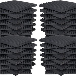 May include: A stack of 48 black acoustic foam panels, each with a pyramid design. The panels are arranged in four stacks of 12 panels each.
