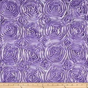 May include: A close-up of a lavender fabric with a rosette pattern. The fabric is soft and has a subtle sheen.