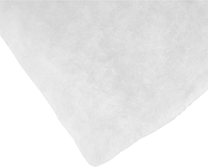 May include: White, non-woven fabric sheet. The fabric is soft and has a slightly textured surface.