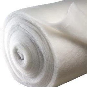 May include: A white roll of landscape fabric, a type of weed barrier used in gardening.