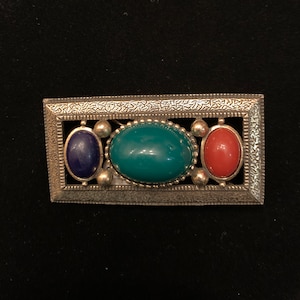 Vintage Les Bernard signed gold rectangular brooch with 3  multi-colored cabochons.