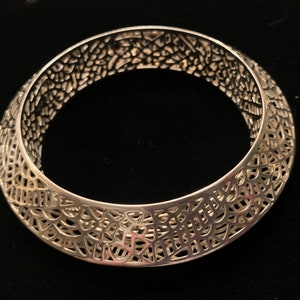 Vintage sterling silver 925 Thailand multi-dimensional  bangle with cutouts and a beautiful design.