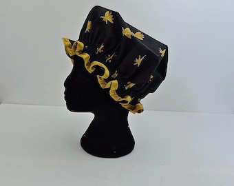 Zwart-gouden bij design douchemuts