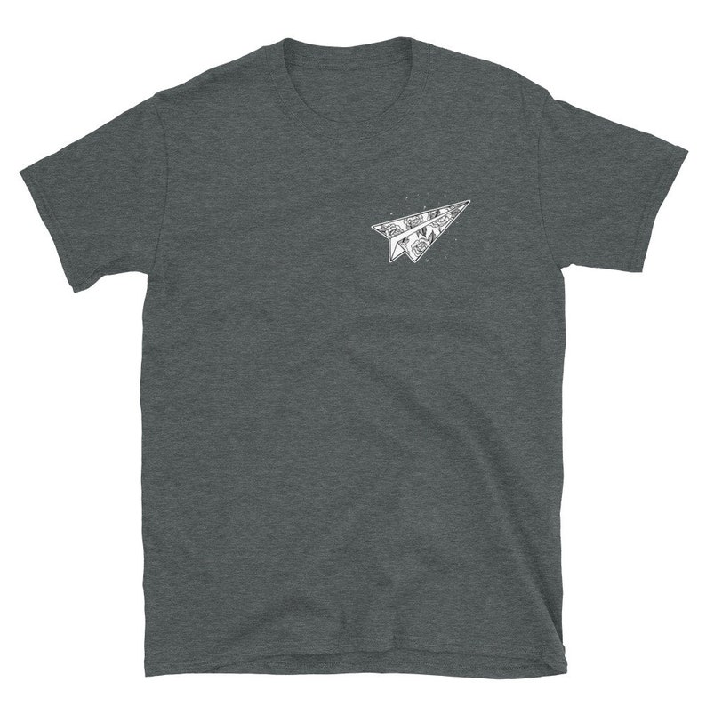 May include: A dark heather grey t-shirt with a white paper airplane graphic. The airplane is made of a detailed pattern.