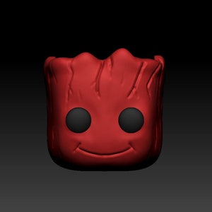 Puede incluir: Figura de personaje de ficción rojo y negro con una cara sonriente y ojos grandes.