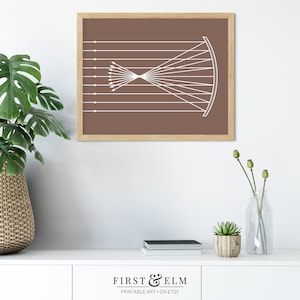 May include: A framed print featuring a white geometric design on a brown background. The design depicts converging lines and a curved shape, resembling a scientific diagram. The frame is made of light-colored wood. The text "FIRST & ELM PRINTABLE ART &bull; ON ETSY" is at the bottom.