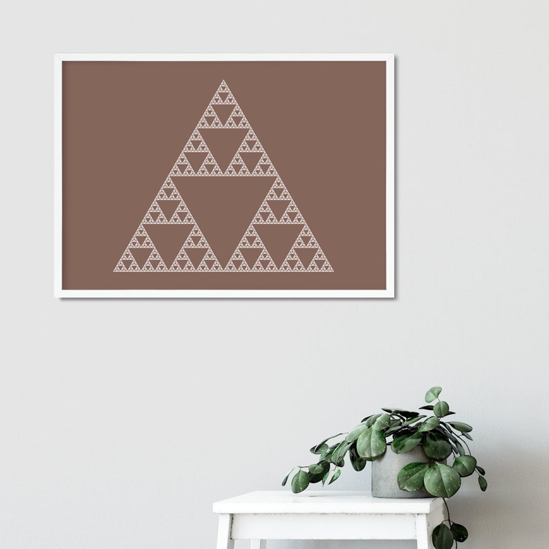 May include: A framed print featuring a Sierpinski triangle fractal design. The artwork showcases a repeating pattern of smaller triangles within a larger triangle, rendered in white against a brown background. The print is displayed in a white frame.