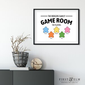 May include: A printable wall art design featuring the text "The Rodgers Family Game Room" with a list of players and colourful game piece icons.