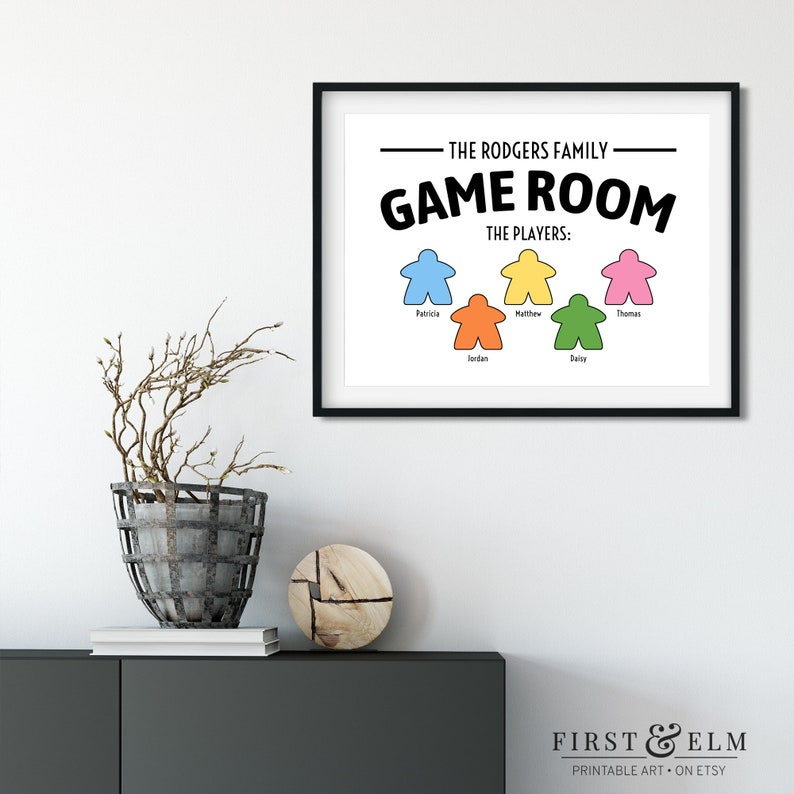 May include: A printable wall art design featuring the text "The Rodgers Family Game Room" with a list of players and colourful game piece icons.