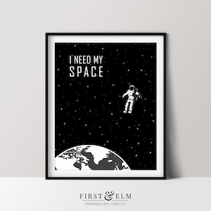 May include: Black and white illustration of an astronaut floating in space with the text "I need my space" above a black and white image of Earth.