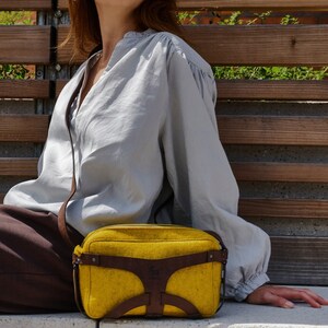 Crossbody bag with sophisticated concept made with sustainable materials in color combination - Fire-orange-melange / brown