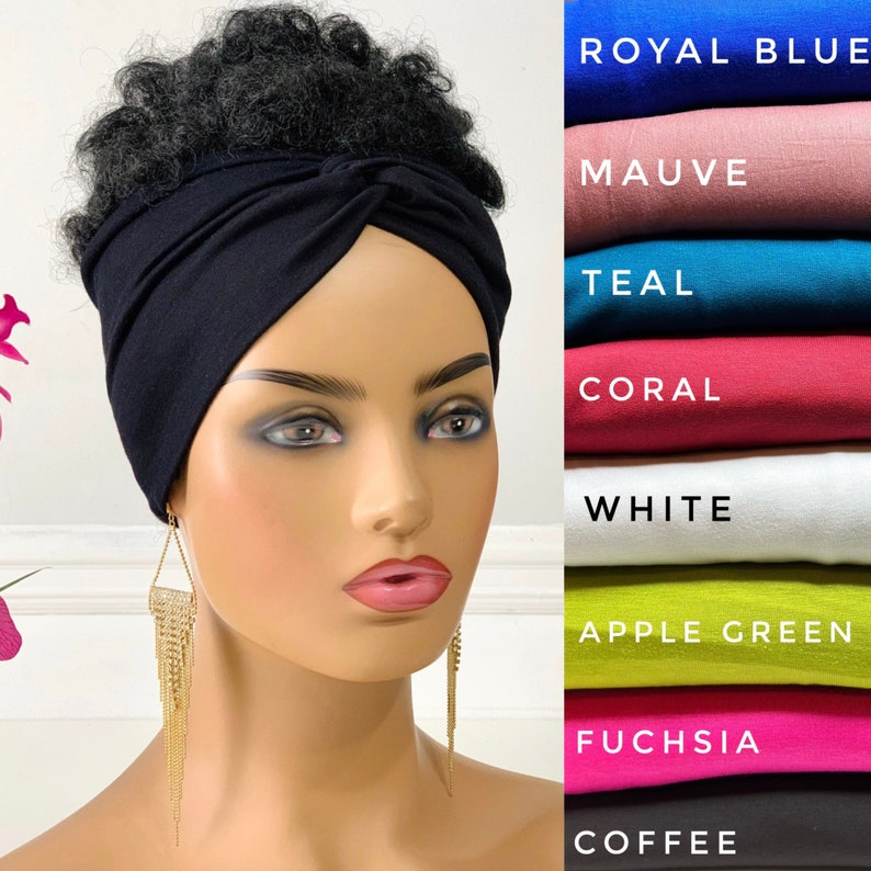May include: A black stretchy turban headband worn on a mannequin with long, dangling gold earrings. The headband is knotted on top of the head. The image shows a variety of colors for the headband, including royal blue, mauve, teal, coral, white, apple green, fuchsia, and coffee.
