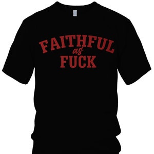 May include: Black t-shirt featuring the text "FAITHFUL as FUCK" in red, arched across the chest. The word "NER" and "FAITHFUL" are printed in red at the bottom of the shirt.
