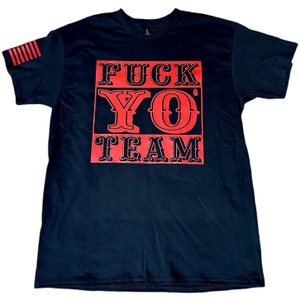 May include: Black t-shirt featuring a red square graphic with the text "FUCK YO TEAM" in a bold, vintage-style font.