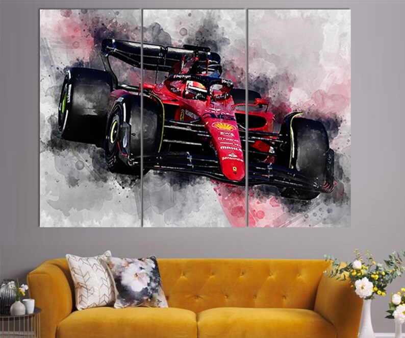 May include: A red Formula 1 race car with black accents and a watercolor background. The car is in motion and the background is blurred.