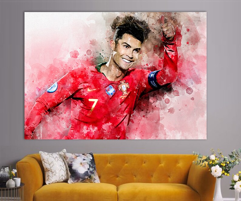 May include: A watercolor painting of a soccer player wearing a red jersey with the number 7 on it. The player is giving a thumbs up and smiling. The background is a pink and white watercolor wash.