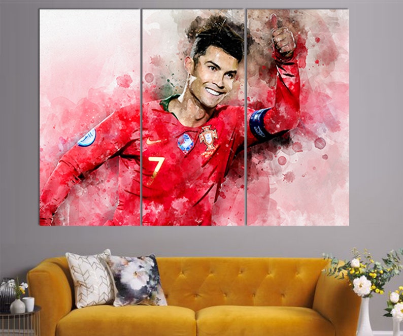 May include: A watercolor painting of a soccer player in a red jersey with the number 7 on the front. The player is giving a thumbs up and smiling. The background is a watercolor wash of pink and white.