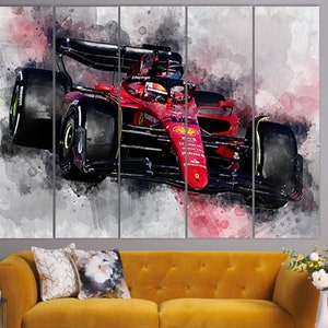 May include: A red Formula 1 race car with black accents and a watercolor effect. The car is in motion and the background is blurred.
