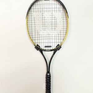 Enkele muurbevestiging voor tennisracket