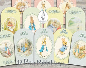 May include: Twelve printable Peter Rabbit gift tags featuring various illustrations of Peter Rabbit in different poses and settings. The tags are designed with a light green and blue background with a white border and a wreath of leaves and flowers.