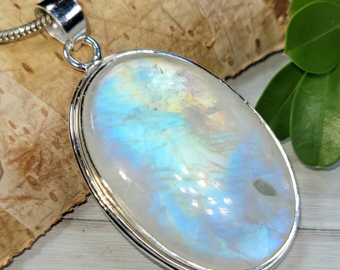 Natural AAAA Grade Multi Full Flash Rainbow Moonstone Oval .925 Sterling Silver Pendant Measures 2 1/8" x 1 3/8" Weighs 22 Grams CT05