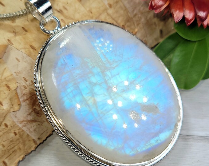 Natural AAAA Grade Multi Full Flash Rainbow Moonstone Oval .925 Sterling Silver Pendant Measures 2 1/8" x 1 3/8" Weighs 22 Grams CT05