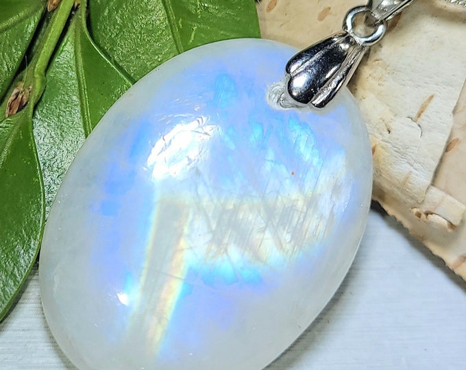 Natural Blue Flash Rainbow Moonstone Oval Cabochon .925 Sterling Silver Pendant Rhodium Plated Sterling Silver Bail  1 1/2" x 7/8" ES39