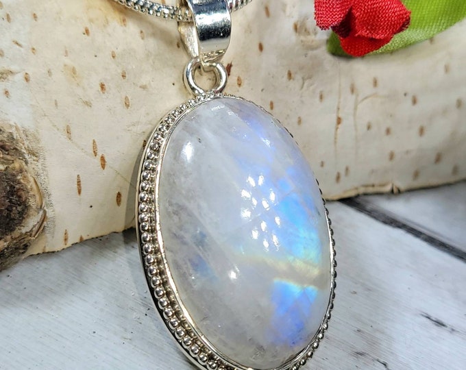 Natural AAA Grade Multi Full Flash Rainbow Moonstone Oval .925 Sterling Silver Pendant Measures 1 3/4" x 7/8" Weighs 10 Grams DA50