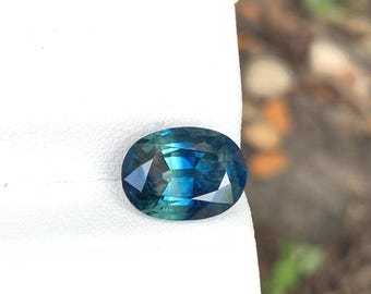 Natural parti sapphire ,( bi color sapphire ) teal sapphire oval shape , loose faceted sapphire, 4.28 cts