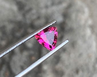 Natural rubellite tourmaline from Nigeria in trillion shape , loose cut stone semiprecious gemstone for ring and jewelry making . 0.70 cts