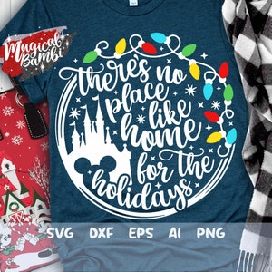 May include: White text on a blue background reads "There's no place like home for the holidays" with a Mickey Mouse head and a silhouette of Cinderella's castle. The text is surrounded by a circle of colorful Christmas lights.