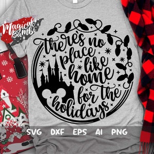 May include: A gray t-shirt with a black circle design featuring a Mickey Mouse head, a castle silhouette, and the text "There's no place like home for the holidays".