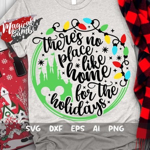 May include: A green circle with a white outline and a string of colorful lights around it. Inside the circle is a green silhouette of the Cinderella Castle, a Mickey Mouse head, and the text "There's no place like home for the holidays".