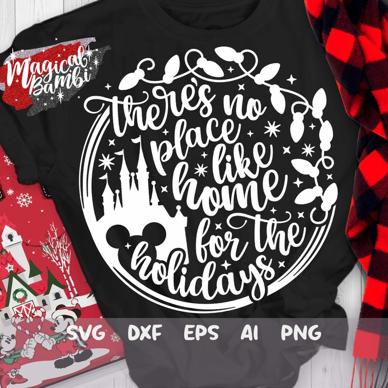May include: A black t-shirt with a white circle design featuring a Mickey Mouse head, a silhouette of Cinderella's castle, and the text "There's no place like home for the holidays".