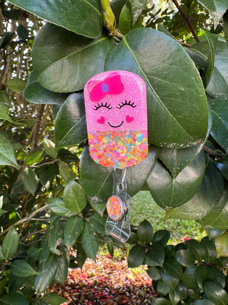 Happy Pill Badge Reel: 2”, Pink with Pink Bow, Retractable Swivel Alligator Clip, Nurse, Pharmacy image 3