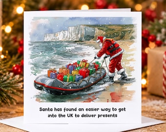 May include: A square greeting card featuring a watercolor illustration of Santa Claus in a red suit pulling a grey inflatable boat filled with colorful wrapped gift boxes onto a sandy beach near white cliffs. The text reads: Santa has found an easier way to get into the UK to deliver presents.