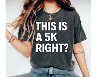 May include: A dark gray t-shirt with the text "THIS IS A 5K RIGHT?" printed in white.