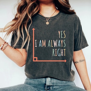 May include: A dark gray t-shirt with a graphic of a right angle and the text "YES I AM ALWAYS RIGHT" in rainbow colors.