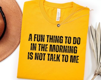 Camiseta "Una cosa divertida para hacer por la mañana es no hablarme", refranes divertidos, sarcástica, divertida para mujer, unisex.