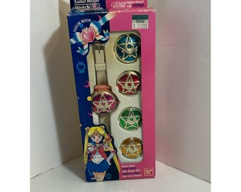 Vintage 1993 Sailor Moon digital wristwatch with different coloured covers