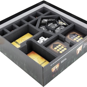 May include: A foam insert for a board game box. The insert has compartments for game pieces, cards, and dice. The insert is black and gray and has a textured surface. The insert is designed to fit in a box with the text "The Stand at the End of the World" printed on the side.