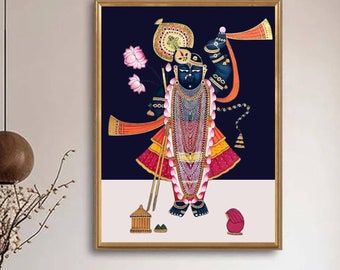 Può includere: Un dipinto incorniciato di una divinità indù, Krishna, con un abito colorato e ornato. Il dipinto è su uno sfondo blu scuro e presenta dettagli intricati.